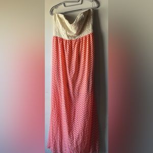 Tan and pink halter dress with cutout in back. NWOT